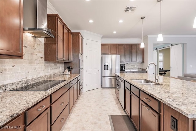 kitchen with black electric stovetop, wall chimney exhaust hood, sink, a barn door, and stainless steel fridge with ice dispenser