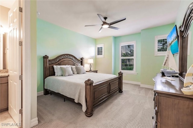 bedroom with light carpet and ceiling fan