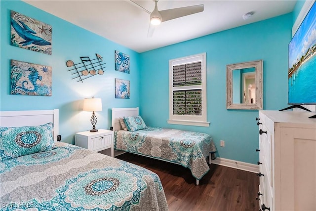 bedroom with ceiling fan and dark hardwood / wood-style floors