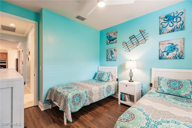 bedroom with ceiling fan and dark hardwood / wood-style floors