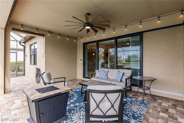 view of patio featuring an outdoor living space and ceiling fan