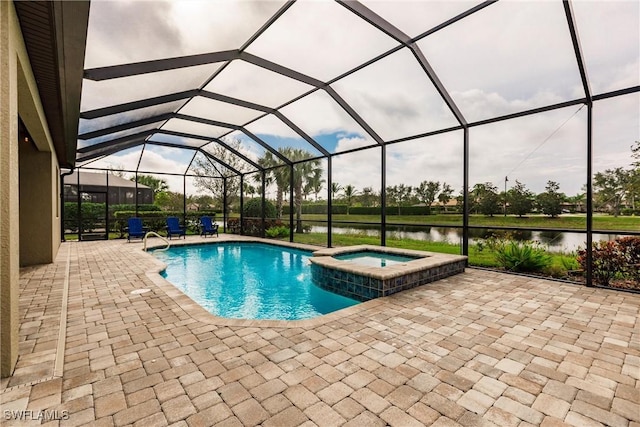 view of swimming pool featuring glass enclosure, a patio area, a water view, and an in ground hot tub