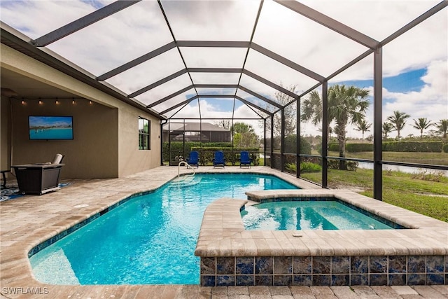 view of pool featuring a water view, a lanai, an in ground hot tub, and a patio