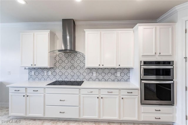 11041 Castlereagh St, Fort Myers, FL 33913 - kitchen with light countertops, black electric cooktop, wall chimney exhaust hood, white cabinets, and tasteful backsplash