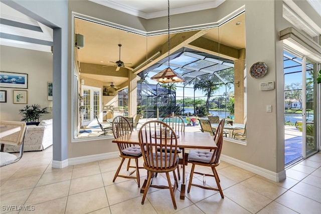 dining area with ceiling fan, a wealth of natural light, and light tile patterned flooring