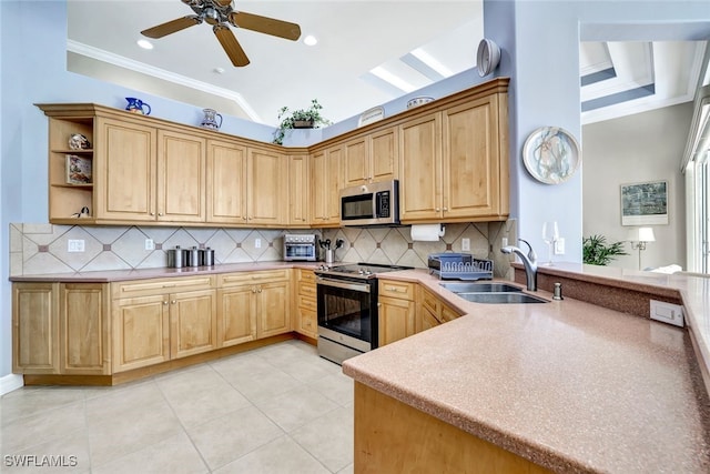 kitchen with stainless steel appliances, tasteful backsplash, crown molding, and sink