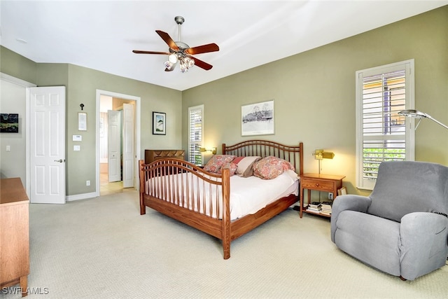 bedroom with light colored carpet and ceiling fan