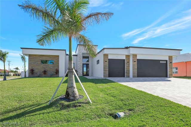 modern home with a front lawn and a garage