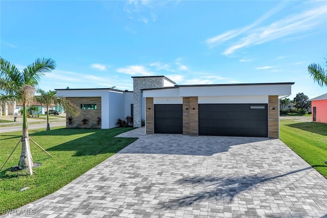 contemporary house with a front lawn and a garage