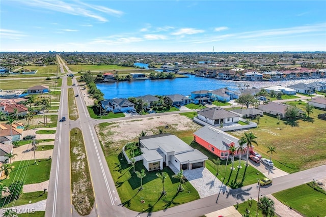 birds eye view of property featuring a water view