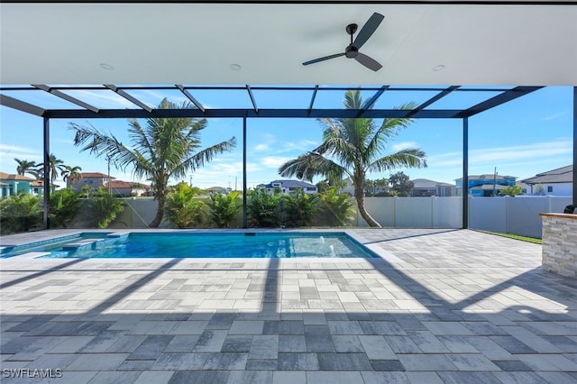 view of pool featuring a lanai, a patio area, and ceiling fan