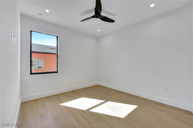 spare room with ceiling fan and light hardwood / wood-style floors