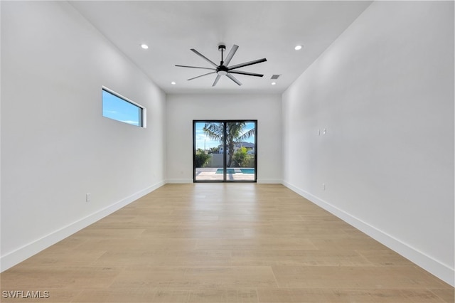 unfurnished room featuring ceiling fan and light hardwood / wood-style flooring