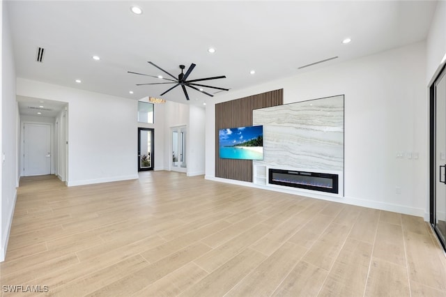 unfurnished living room featuring light hardwood / wood-style flooring