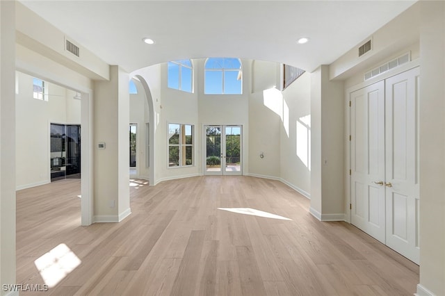 unfurnished living room with light hardwood / wood-style flooring