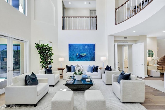 7817 Vizcaya Way, Naples, FL 34108 - living room featuring a towering ceiling, french doors, plenty of natural light, and recessed lighting