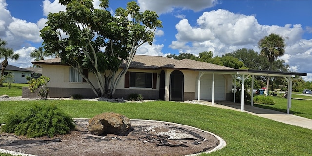 view of front of property with a carport and a front lawn