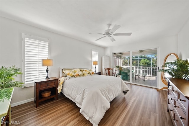 bedroom featuring ceiling fan, access to exterior, and light hardwood / wood-style flooring