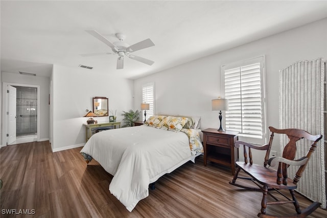 bedroom with ceiling fan, dark hardwood / wood-style flooring, and ensuite bathroom