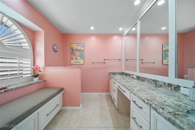 bathroom with tile patterned flooring and vanity