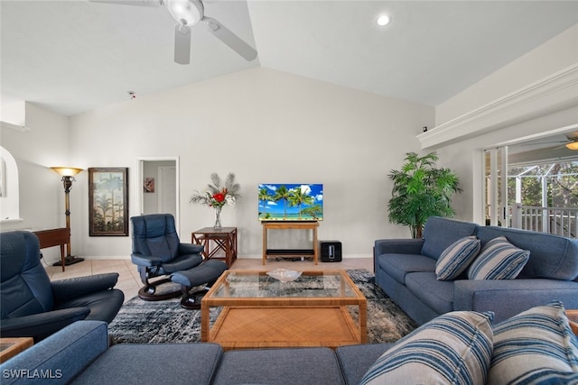 living room featuring ceiling fan, light tile patterned floors, and high vaulted ceiling