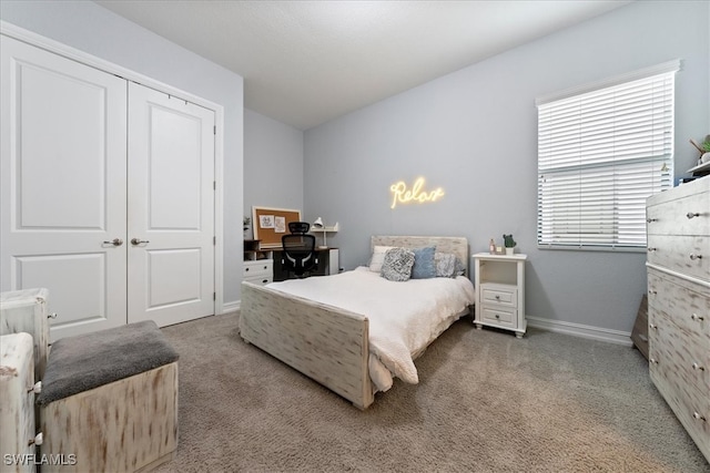 carpeted bedroom featuring a closet