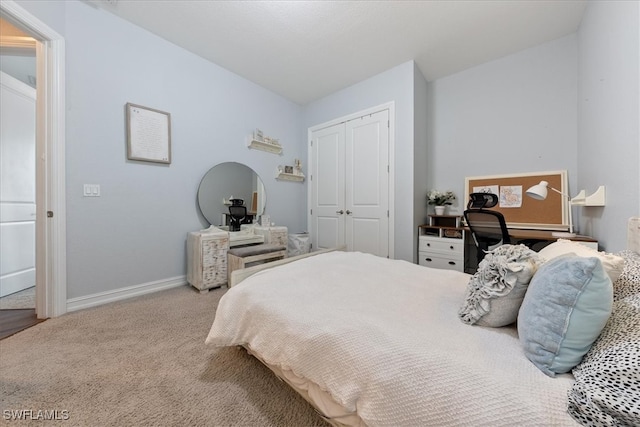 carpeted bedroom with a closet