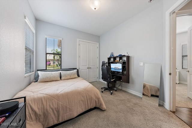 bedroom featuring a closet and carpet flooring