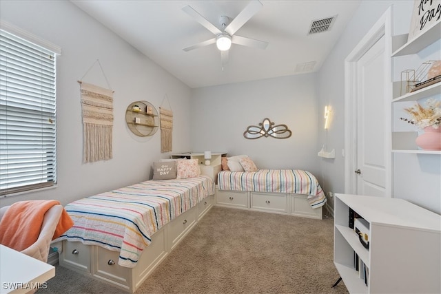 bedroom featuring ceiling fan and light colored carpet