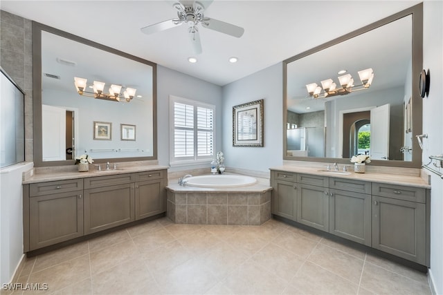 bathroom featuring vanity, tile patterned floors, and shower with separate bathtub