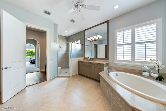 bathroom with vanity, tile patterned floors, shower with separate bathtub, and ceiling fan