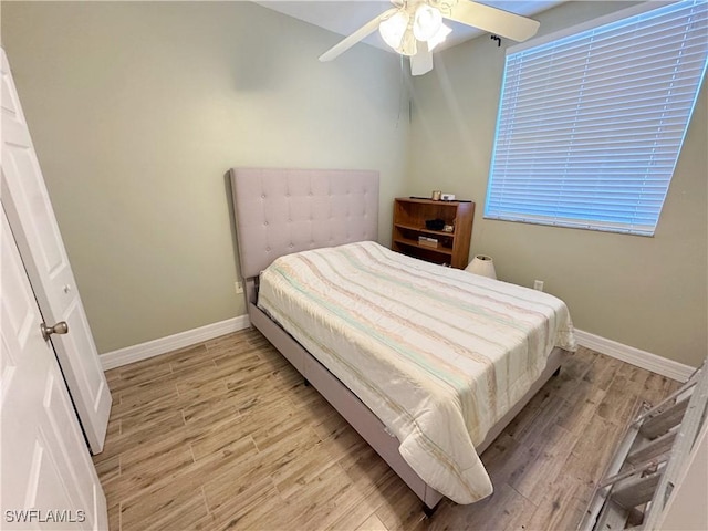 15393 Bellamar Cir Unit 522, Fort Myers, FL 33908 - bedroom with light wood-style flooring, baseboards, and ceiling fan