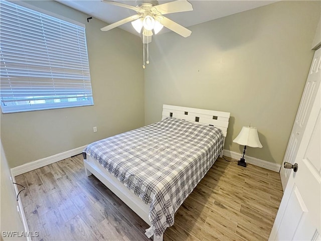 15393 Bellamar Cir Unit 522, Fort Myers, FL 33908 - bedroom with light wood-type flooring, baseboards, and ceiling fan