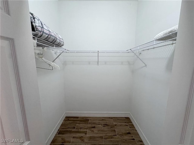 15393 Bellamar Cir Unit 522, Fort Myers, FL 33908 - walk in closet featuring wood finished floors