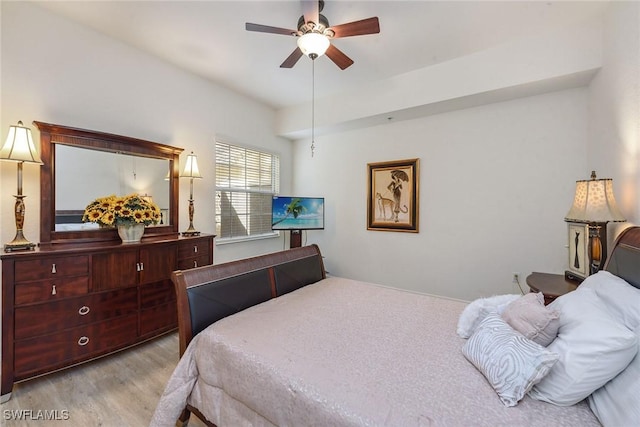 bedroom with light hardwood / wood-style flooring and ceiling fan