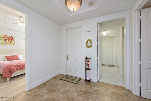 3745 Montreux Ln Unit 102, Naples, FL 34114 - entryway with ceiling fan and baseboards