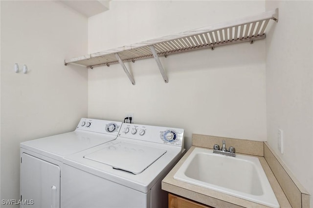 3745 Montreux Ln Unit 102, Naples, FL 34114 - laundry room featuring a sink and washer and clothes dryer