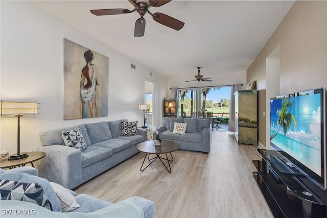 living room with ceiling fan and light wood-type flooring