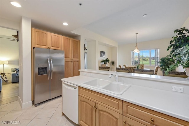 3745 Montreux Ln Unit 102, Naples, FL 34114 - kitchen featuring stainless steel fridge with ice dispenser, white dishwasher, pendant lighting, light tile patterned floors, and light countertops