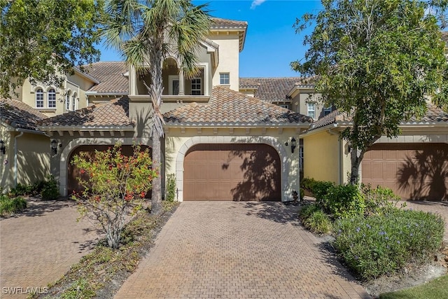 3745 Montreux Ln Unit 102, Naples, FL 34114 - mediterranean / spanish-style house with decorative driveway, stucco siding, and a tiled roof
