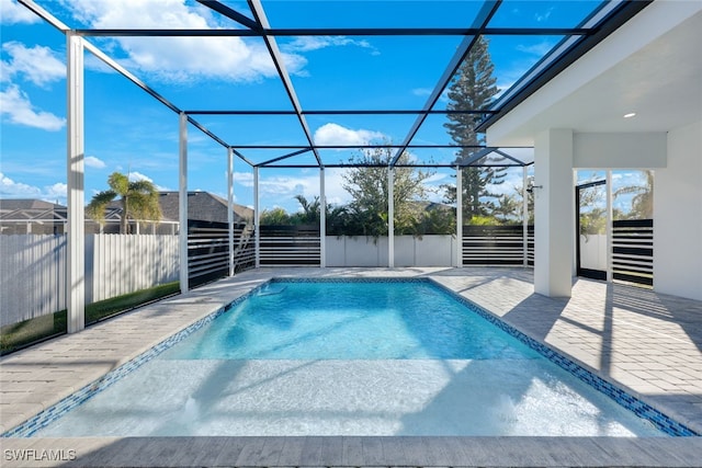 view of pool featuring a patio area and a lanai