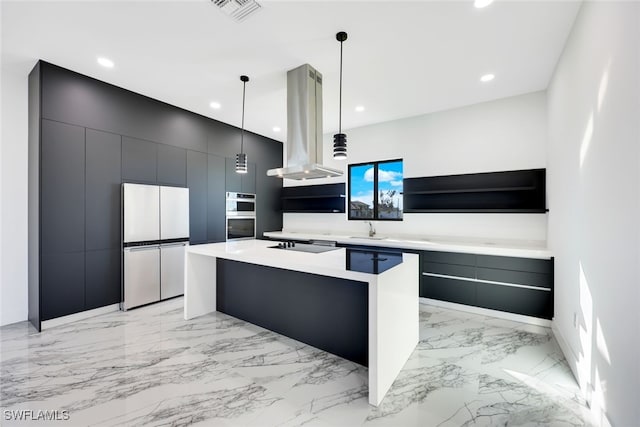 kitchen featuring sink, hanging light fixtures, white fridge, island range hood, and a kitchen island