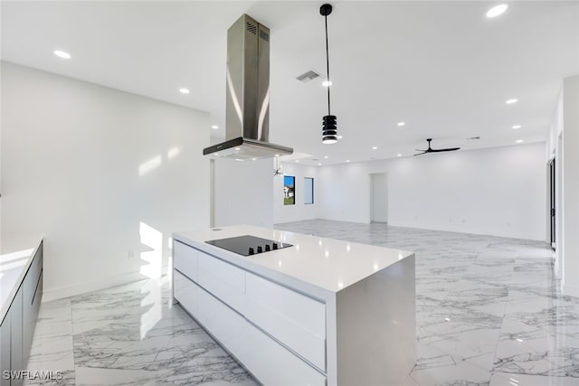 kitchen with ventilation hood, ceiling fan, a spacious island, pendant lighting, and white cabinetry