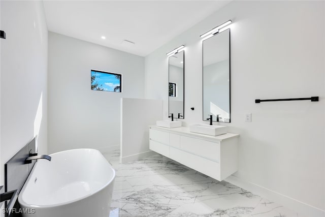 bathroom with a bathing tub and vanity