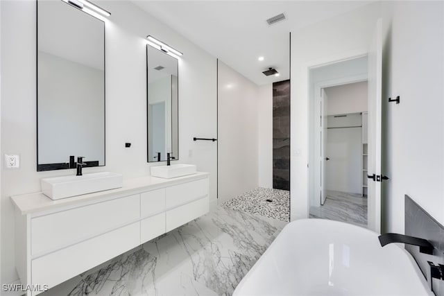 bathroom featuring vanity and shower with separate bathtub