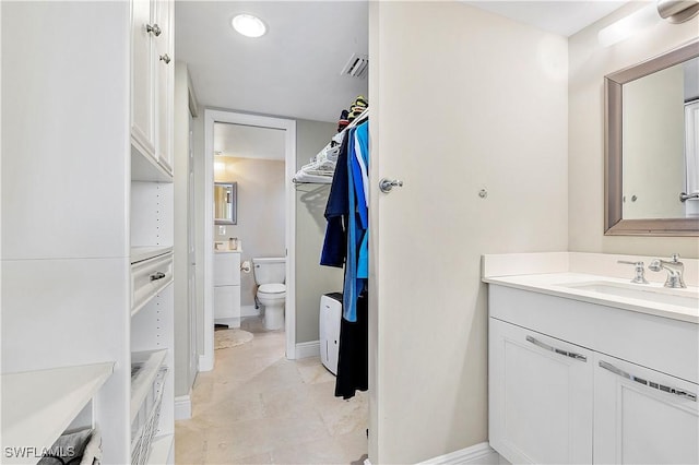 5 Bluebill Ave Unit 701, Naples, FL 34108 - bathroom featuring vanity, toilet, baseboards, and tile patterned flooring