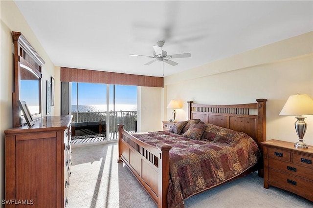 carpeted bedroom with ceiling fan and access to outside