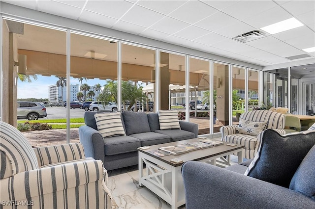 sunroom / solarium featuring visible vents and a wealth of natural light