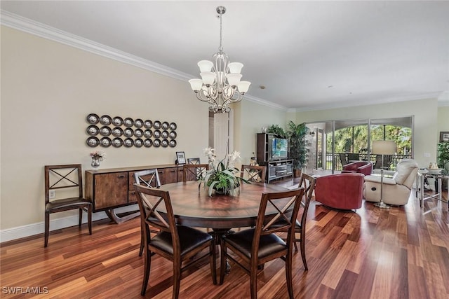3189 Aviamar Cir Unit 202, Naples, FL 34114 - dining area featuring a chandelier, ornamental molding, wood finished floors, and baseboards