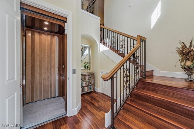 3189 Aviamar Cir Unit 202, Naples, FL 34114 - entrance foyer with wood finished floors, stairway, and baseboards